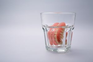 dentures soaking in water