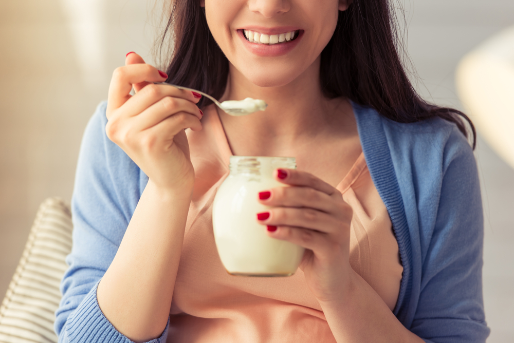 woman eating yogurt