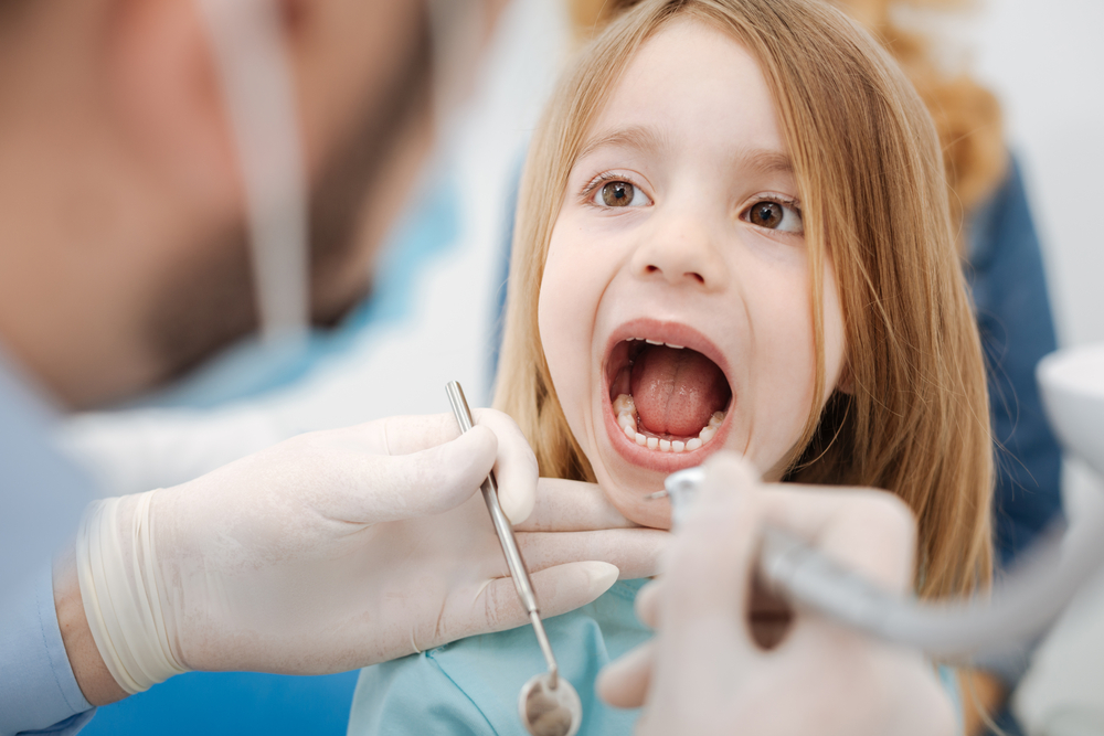 little girl at the dentist