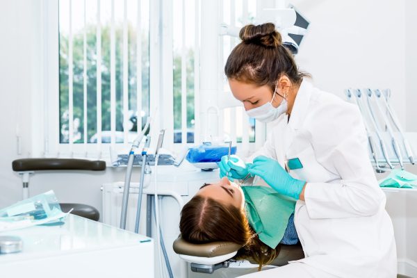 Dentist performing a dental treatment